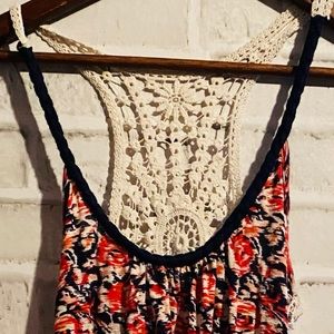 Woman’s racer back tank top with embroidered p